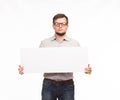 Young bored man showing presentation, pointing on placard