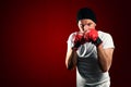 Young boxer sportsman in red sport suit opy space for text