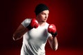 Young boxer sportsman in red sport suit opy space for text