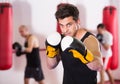 boxer trains in kickboxing gloves