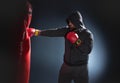 Young boxer trains on punching bag