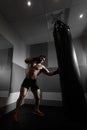 Young boxer trains on punching bag