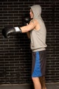 Young boxer working out against a brick wall Royalty Free Stock Photo