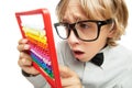 Young boy with abacus toy calculator Royalty Free Stock Photo