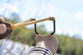 Young Boy Aiming Sling Shot Over Lake Royalty Free Stock Photo