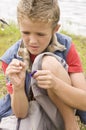 Young boy angling at a lake Royalty Free Stock Photo