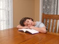 Young boy asleep while reading