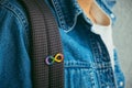 Young boy with autism infinity rainbow symbol sign. World autism awareness day, autism rights movement, neurodiversity