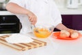 Young boy baking whipping eggs Royalty Free Stock Photo