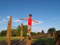 Young boy on a balance beam