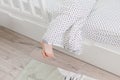 Child bare feet bed under blanket Royalty Free Stock Photo