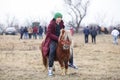 Young boy is bareback riding a pony before an Epiphany celebration horse race Royalty Free Stock Photo