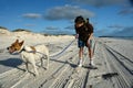Young boy on beach with dog Royalty Free Stock Photo