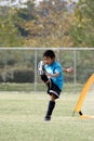 Young boy with a big kick in soccer Royalty Free Stock Photo