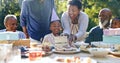 Young boy, birthday cake or family in garden for party, happy or gift in celebration in nature. Black people, smile and Royalty Free Stock Photo