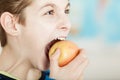 Young boy biting into a large fresh apple Royalty Free Stock Photo