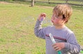 Young boy blowing bubbles Royalty Free Stock Photo