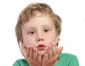 Young boy blowing kisses Royalty Free Stock Photo