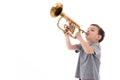 Young boy blowing into a trumpet Royalty Free Stock Photo