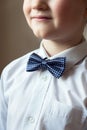 Young boy with blue bow tie Royalty Free Stock Photo