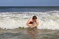 Young boy is body surfing in the waves Royalty Free Stock Photo