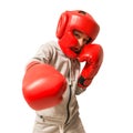 Young boy boxer practicing punches. Isolated on white background Royalty Free Stock Photo