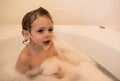 Young boy in a bubble bath Royalty Free Stock Photo