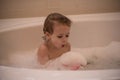 Young boy in a bubble bath Royalty Free Stock Photo