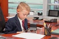 Young Boy in Business Office Royalty Free Stock Photo