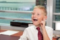 Young Boy in Business Office Royalty Free Stock Photo