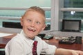 Young Boy in Business Office Royalty Free Stock Photo