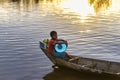 Young boy in a canoe in Tonle Sap lake, Cambodia Royalty Free Stock Photo