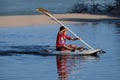 A young boy canoeing in the kiddies pool