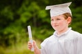 Young boy with cap and gown