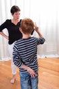 Young boy is cheating - mother looking angry Royalty Free Stock Photo