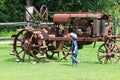 Boy and antique tractor