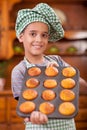 Young boy chief showing his made corn bread Royalty Free Stock Photo