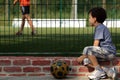 Young boy child watching football game for grid Royalty Free Stock Photo