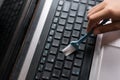 Young boy cleaning laptop computer Royalty Free Stock Photo