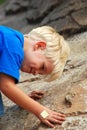 Young boy climbing rocks Royalty Free Stock Photo