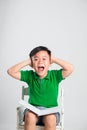 Young boy with closed eyes covering ears with hands Royalty Free Stock Photo