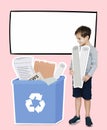 Young boy collecting papers for recycling