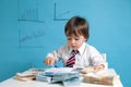 Young boy, counting money, taking notes Royalty Free Stock Photo