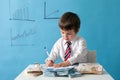 Young boy, counting money and taking notes Royalty Free Stock Photo