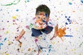 Young Boy Covered in Paint Splatter Royalty Free Stock Photo