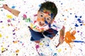 Young Boy Covered in Paint Splatter Royalty Free Stock Photo