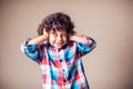Young boy with covering his ears with hands.Children, emotions concept Royalty Free Stock Photo
