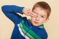 Young boy covering his eye. Royalty Free Stock Photo