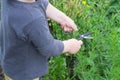 Young boy is cutting herbs