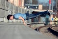 A young boy dancing breakdance on the street. Royalty Free Stock Photo